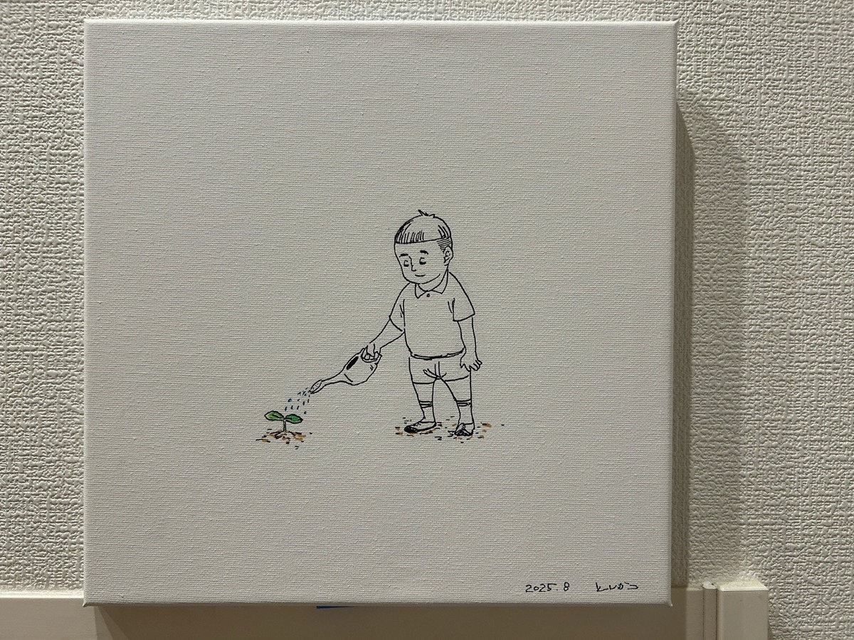 水をやる少年