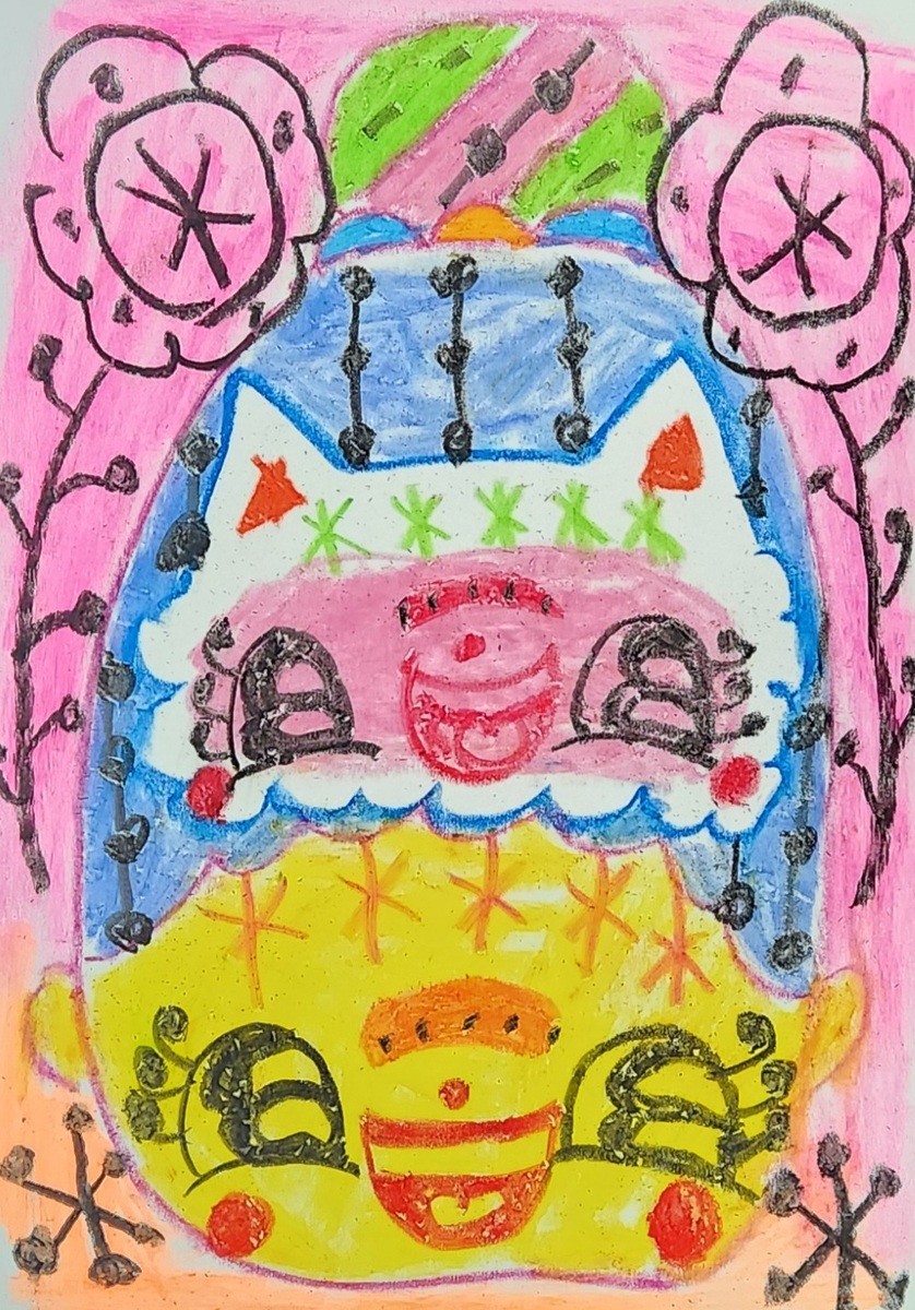 おだんご頭の女の子とねこ